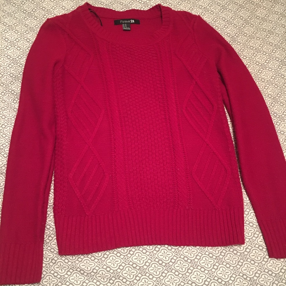 Red sweater, and only worn once.